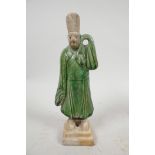 A Chinese Tang dynasty (618-907AD) terracotta figure of a standing male court attendant, Sancai glaz