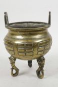 A Chinese Qing period bronze censer with two loop handles, the body decorated with Pa-Kua trigrams r