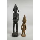 An African carved hardwood tribal fertility figure and another carved wood tribal figure, largest 19