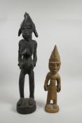 An African carved hardwood tribal fertility figure and another carved wood tribal figure, largest 19