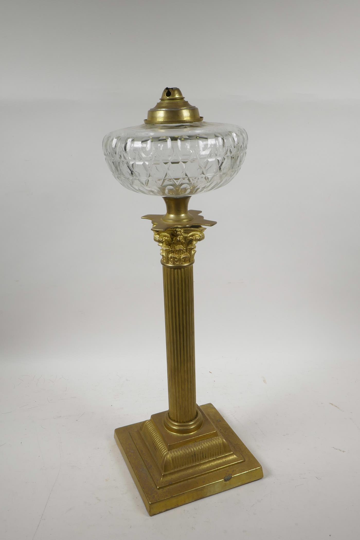 A brass Corinthian column adapted oil lamp with a glass reservoir, 20" high - Image 2 of 2