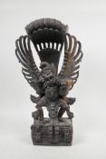 A Balinese hardwood carving of Garuda, 16" high, A/F losses