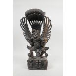A Balinese hardwood carving of Garuda, 16" high, A/F losses
