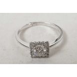 An 18ct white gold square cut diamond cluster ring (60 points), size M/N
