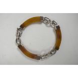 A white metal mounted horn and chainlink bracelet, 7" long