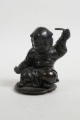 A C19th/20th Chinese bronze mount(?) in the form of a child, 3½" high