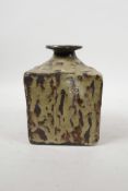 A beige drip glazed art pottery flask/bottle with underglaze impressed alphabet decoration, 6" high