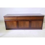 Christian Linneberg, a mid century Danish low sideboard, with three frieze drawers over three cupboa