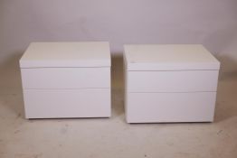 A pair of contemporary white lacquer chests, with two soft close drawers, 24" x 18" x 18"