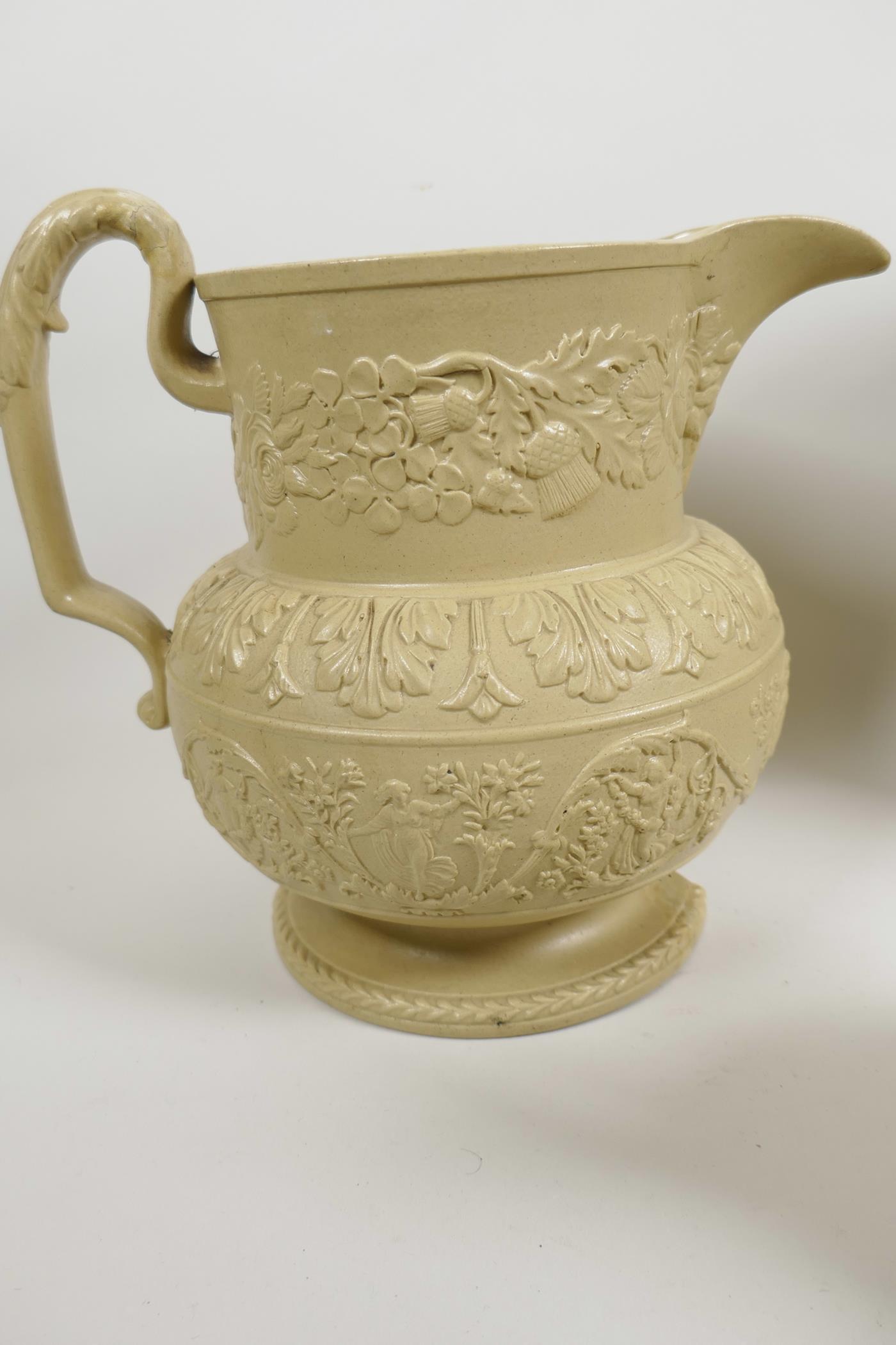 A C19th stoneware jug with embossed decoration of roses, thistles and classical figures, 7½" high, t - Image 3 of 5