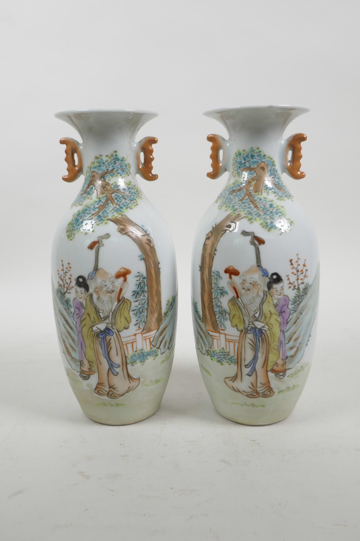 A pair of Chinese Republic famille rose porcelain vases with two handles, decorated with a sage and
