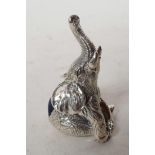 A tiny silver pincushion cast in the form of an elephant, 1¼" long