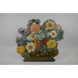 A hand painted metal fire guard/screen in the form of a basket full of flowers, 15" high