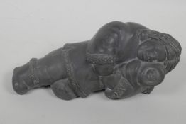 An Inuit black soapstone carving of a mother and child, 8½" long