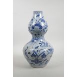 A Chinese Ming style blue and white porcelain double gourd vase decorated with waterfowl on a lotus