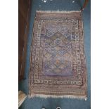 A Persian brown ground wool rug with geometric blue and red decoration, 47" x 75"