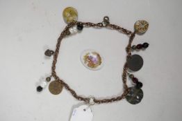 A twin strand charm bracelet set with replica medieval coins and tokens, 12" long, and a Limoges por