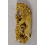 A late C19th/early C20th carved ivory parasol handle carved with a lion fighting a dragon, 3" long,