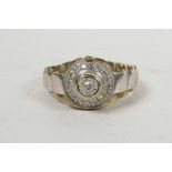 A men's 9ct gold decorative ring inset with a round brilliant cut diamond and surrounded by pave dia