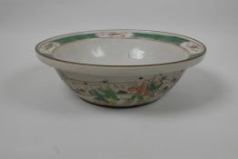 A Chinese famille verte crackleware bowl decorated with Shou Lao to centre, and boys playing to