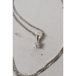 A solitaire diamond pendant set in 18ct gold on 18ct gold chain, 3.9 grams gross