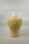 A Chinese cream glazed pottery meiping vase and cover, 14" high