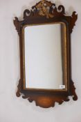 A Georgian style inlaid mahogany fretwork hand mirror, with parcel gilt decoration and carved ho-