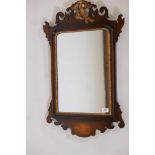 A Georgian style inlaid mahogany fretwork hand mirror, with parcel gilt decoration and carved ho-