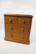 A C19th walnut apprentice chest of two short over two long drawers, 9" x 9" x 4½"