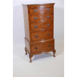 A Bevan Funnell, Reprodux burr walnut bowfronted tallboy chest of five drawers, raised on cabriole