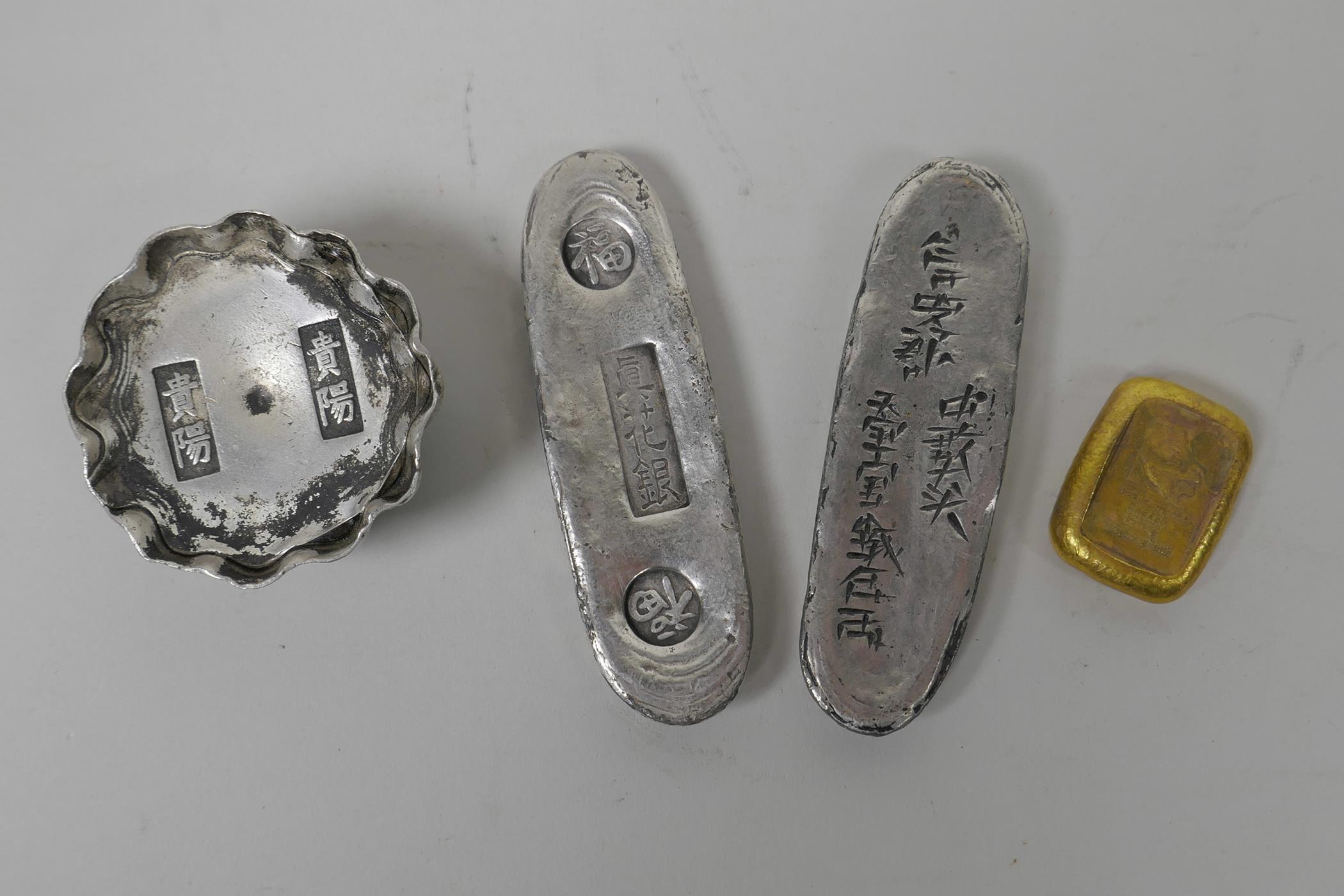 Two Chinese white metal ingots of lozenge form, another circular, and a gilt metal ingot, largest 4" - Image 2 of 5