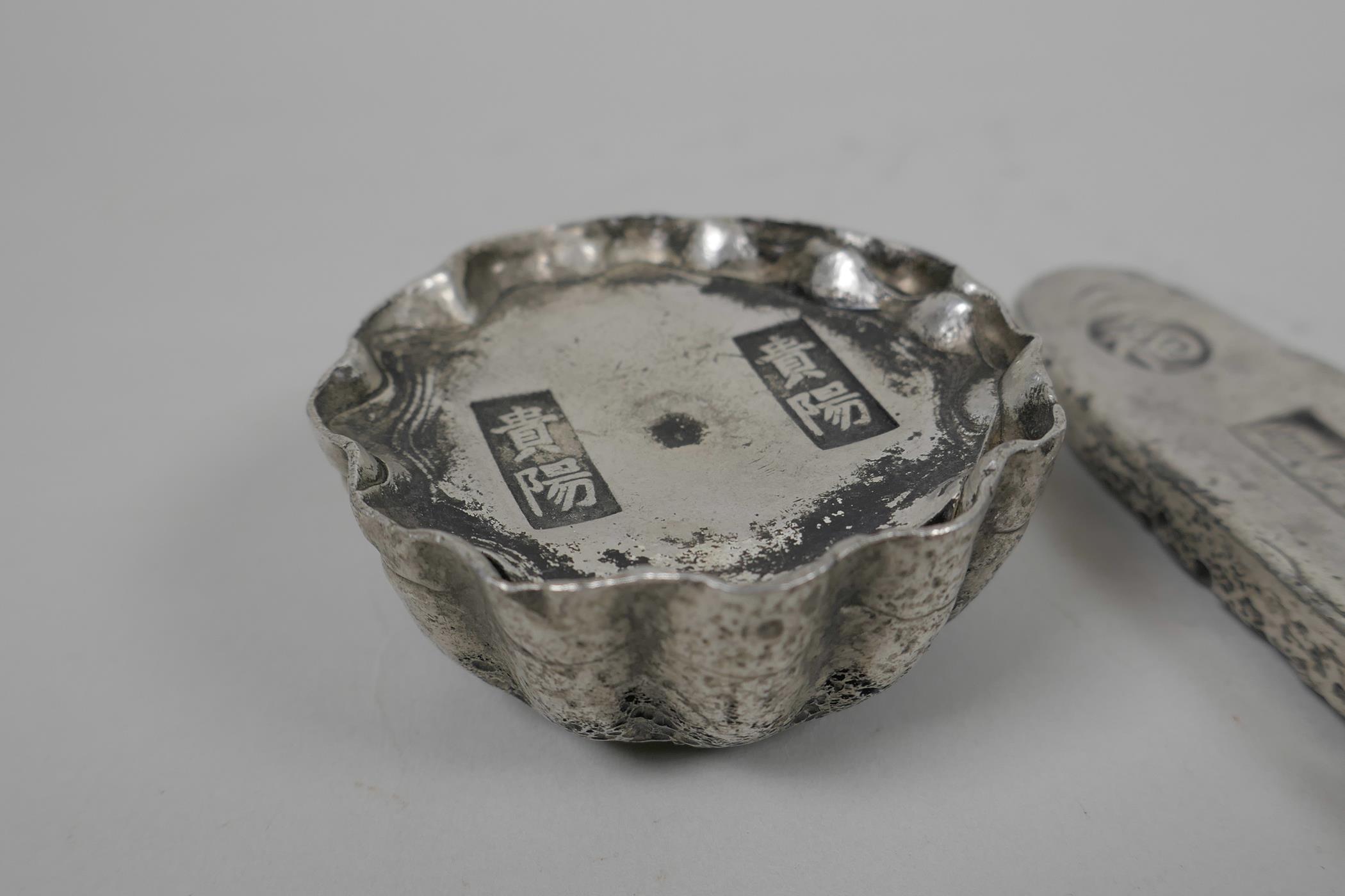 Two Chinese white metal ingots of lozenge form, another circular, and a gilt metal ingot, largest 4" - Image 3 of 5