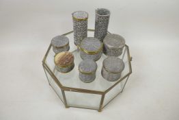An octagonal glass box, A/F, containing various small filigree boxes, 8" across