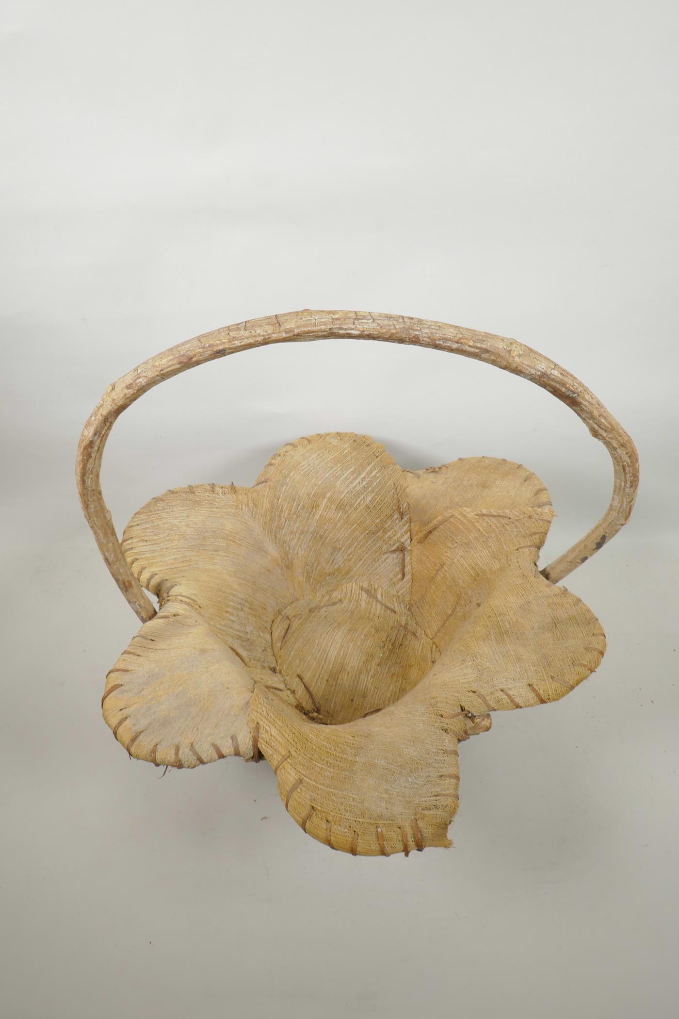 A wood and coconut husk petal shaped basket, 18" high - Image 2 of 3