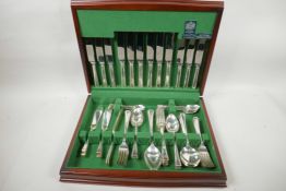 An Arthur Price mahogany canteen of silver plated cutlery, six place settings 16" wide