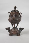 A Chinese coppered metal burner in the form of a censer on the back of a dragon tortoise, with three