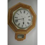 A pine drop dial wall clock with white face and Roman numerals (no movement), 23" long