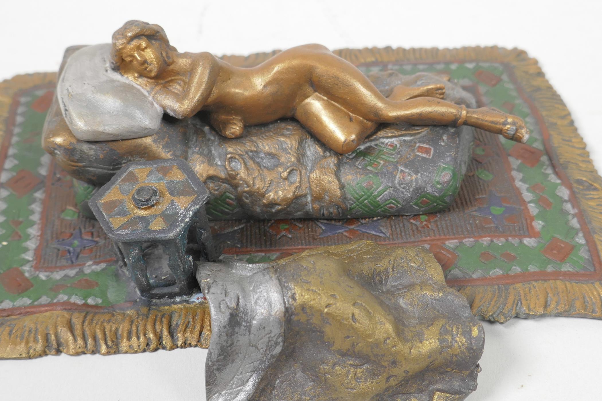 A cold painted bronze figure of a girl lying on a bed, 6¼" long - Image 4 of 4