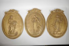 Three gilt plaster plaques with raised decoration depicting classical women, 11" x 15"