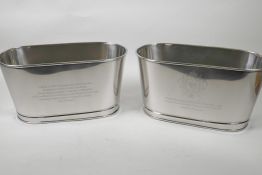 A pair of oval plated champagne coolers engraved with aphorisms from Lily Bollinger and Napoleon, 6"