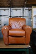 A La-Z-Boy armchair, upholstered in tan leather