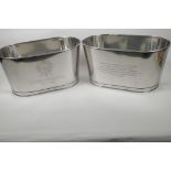 A pair of oval plated champagne coolers engraved with aphorisms from Lily Bollinger and Napoleon, 7"