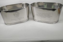 A pair of oval plated champagne coolers engraved with aphorisms from Lily Bollinger and Napoleon, 7"