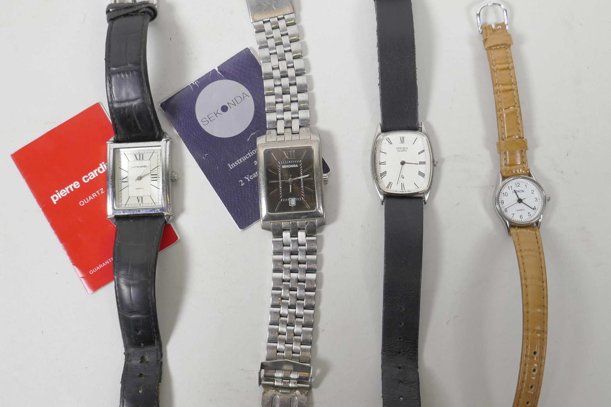 Four watches including a men's Pierre Cardin rectangular analogue quartz dress watch, with Roman