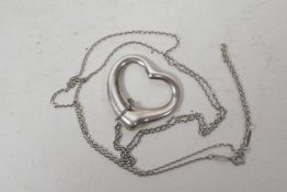 A Tiffany & Co open heart silver pendant on long silver chain (purchased from Tiffany New York)