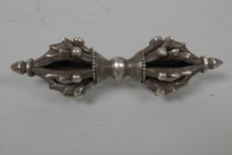 A white metal vajra, 3½" long