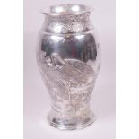 A Japanese Meiji period plated metal vase, embossed and engraved with figures of cranes, 12" high