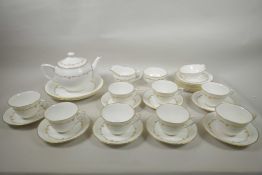 A Royal Worcester Gold Chantilly pattern eight place tea service, 9" diameter, A/F