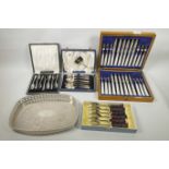 A 12 place mother of pearl and hallmarked silver set of knives and forks in an oak case, Sheffield
