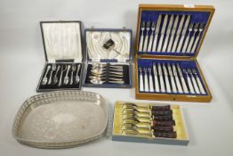 A 12 place mother of pearl and hallmarked silver set of knives and forks in an oak case, Sheffield